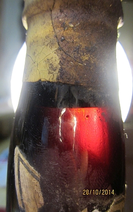 The neck :  Liquid level and deposit on the left